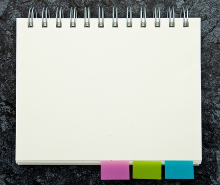 A blank notebook with a tab.の写真素材