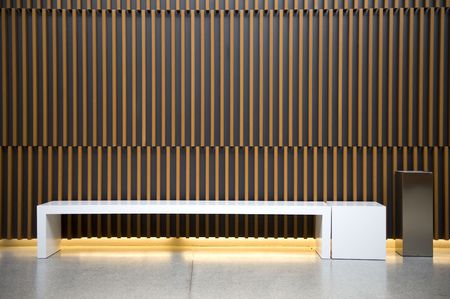 Modern waiting room with ashtray against wooden wallの写真素材