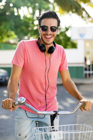 Urban biker with headphonesの写真素材