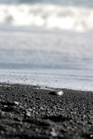 Pebbles on the black beach in Vik, Icelandの写真素材