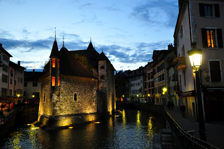 Annecy, France - JUNE 19, 2015 People relaxing, walking, and eating around Palace of the Isle and river Thiou.のeditorial素材