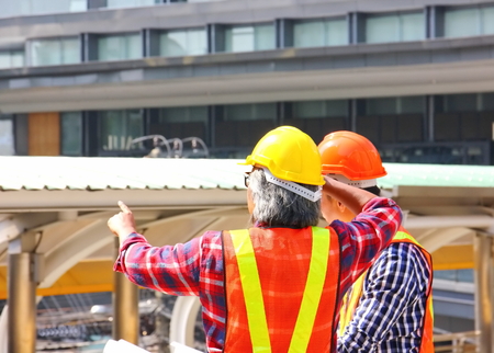 the worker talk to his buddy and looking for the construction site