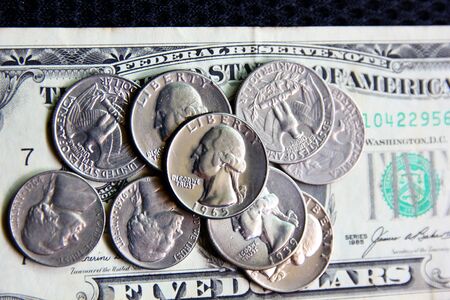 American coins on dollar note,selective focus .coins for saving.の写真素材