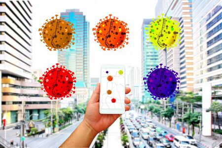 hand holding mobile with illustration of corona virus . in outbreak area poeple loading the virua apps on mobile for checkink and avoid conducting before travel.の写真素材