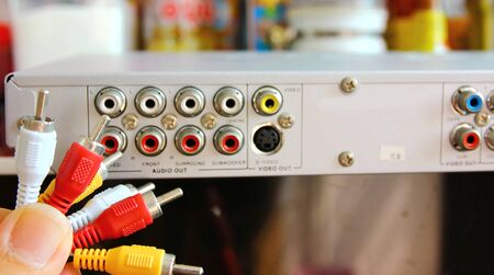 hand holding rca composit line toconnect vedio player.の写真素材