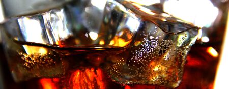 close up whiskey mix soda on ice cubes.の写真素材