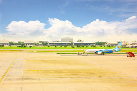 BANGKOK,THAILAND-5 SEPTEMBER;2019:Air Asia low cost airline loading cargo and luggage before departure.air staff working at apron  DON MUANG INTERNATIONAL AIRPORT in cloudy day.のeditorial素材