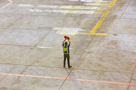 BANGKOK,THAILAND-5 SEPTEMBER;2019:Air Asia low cost airline loading cargo and luggage before departure.air staff working at apron  DON MUANG INTERNATIONAL AIRPORT in cloudy day.のeditorial素材