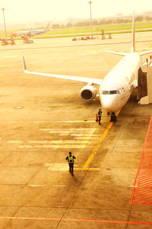 BANGKOK,THAILAND-5 SEPTEMBER;2019:Air Asia low cost airline loading cargo and luggage before departure.air staff working at apron  DON MUANG INTERNATIONAL AIRPORT in cloudy day.のeditorial素材