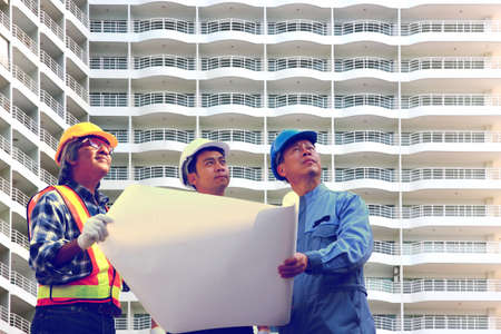 group of engineers standing in front of the project  inspection  the detail of the building