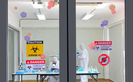the doctor or researcher working in virus lab with illustration of corona virus in lab