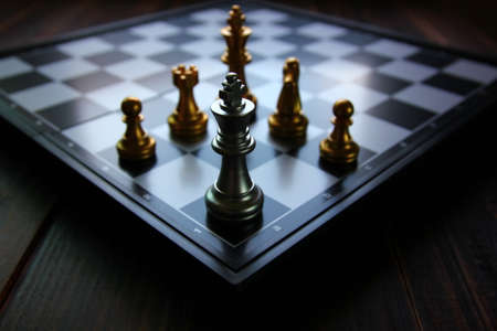 king chess in the corner of chess board on chess game