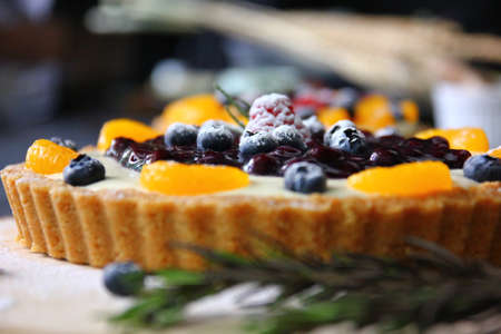 close up the topping of mix fruits pie with icingの写真素材