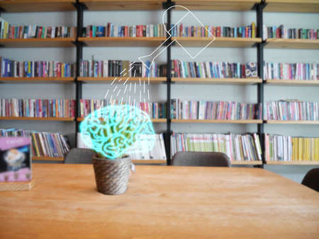 illustration of watering can watering on brain in plant pot on wood table in library, education...