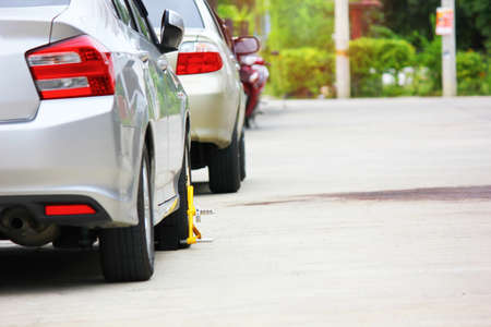 the owner used wheel locked on his gray passenger car anti theftの写真素材