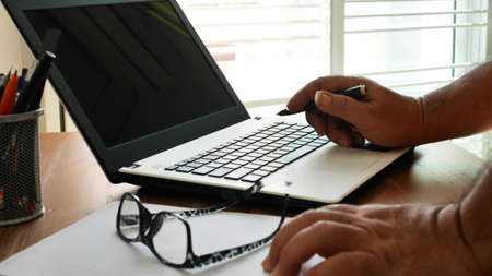 man working with laptopat home , work from home concept