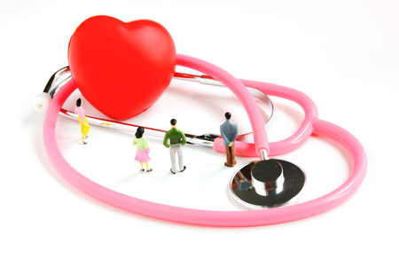 the figure people woman man looking red heart on stethoscoe isolate on whiteの写真素材