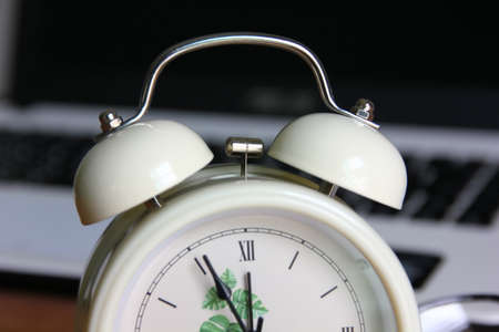 close up alarm clock ring bell with blur backgroundの写真素材