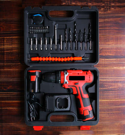the diy electric drill box set on wood floor
