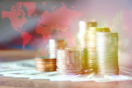 group of coins stacking on bank note with illustration world map trend graph  , business money conceptの写真素材