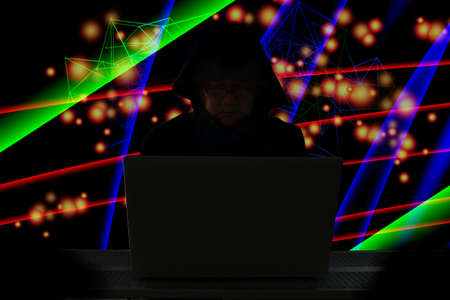 the hacker using laptop online hack secret information world wild