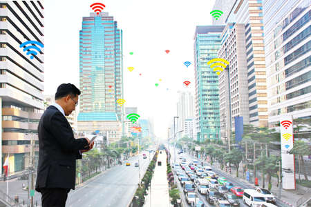 business man using mobile phone communicate  by inter net wifi  which has many service providers in...