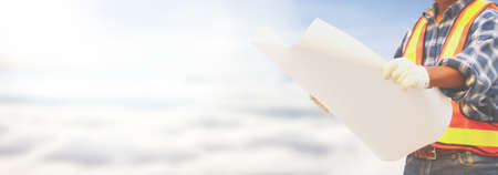 engineer holding blank plan in hand copy spaceの写真素材