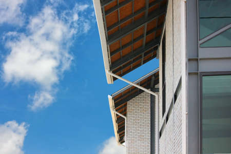 roof steel structure , roof design and modern building with blue sky white cloud