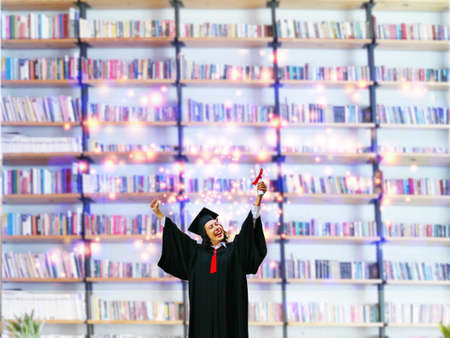 graduate in congratulation moment with book shelf abstract backgroundの写真素材