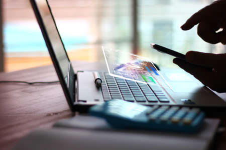 man using mobile phone with futuristic digital technology icon accessibility while working with...
