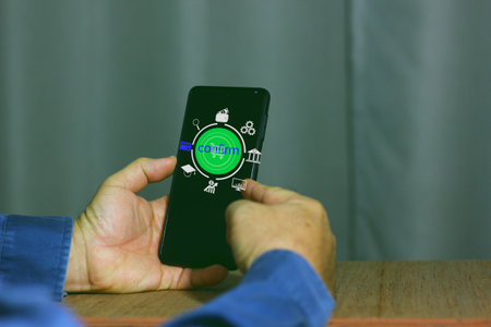 man shopping online on mobile phone, confirm paying by cradit card