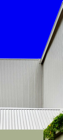 gray corrugated metal wall of  factory warehouse building copy space