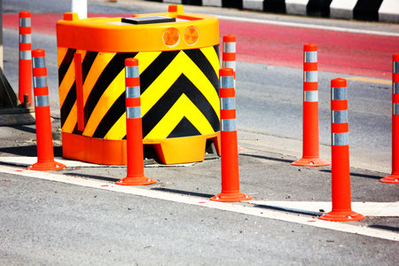 close up traffic cones,  bumper and solar orange flashing light  group of traffic sign on road