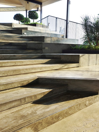 sun light on concrete step wlak way made shadow on groundの写真素材