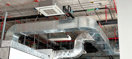 air conditioning circulates cool air system install on concrete buildingの写真素材