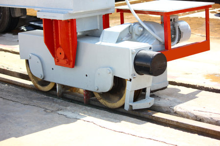 Crane moving equipment set, electric motor drives steel wheels on railsの写真素材
