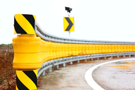 rolling barrier guard rail install on curve lean roadの写真素材