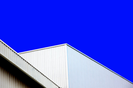 architects design exterior building use corrugated metal wall decorate warehouse  isolated on blue perspective viewの写真素材