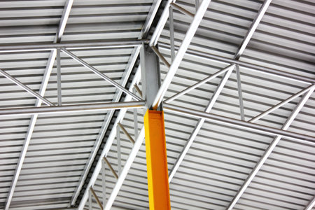 factory warehouse steel structure roof beam corrugated roof top. Cross-welding of steel structures to increase strength while reducing the size of the steelの写真素材