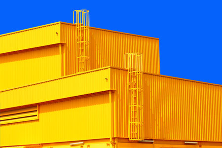 architecture design square shape corrugated wall geometric building. The factory warehouse is exterior decorated with corrugated texture to create a point of interestの写真素材