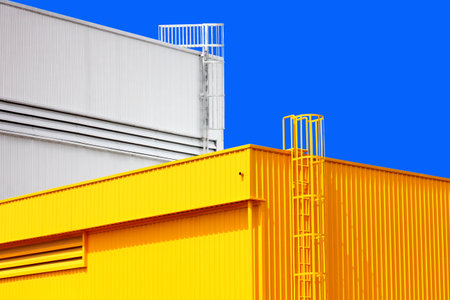 architecture design square shape corrugated wall geometric building. The factory warehouse is exterior decorated with corrugated texture to create a point of interestの写真素材