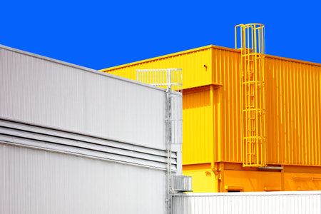 architecture design square shape corrugated wall geometric buiding. The factory warehouse is exterior decorated with corrugated texture to create a point of interest with beautylの写真素材