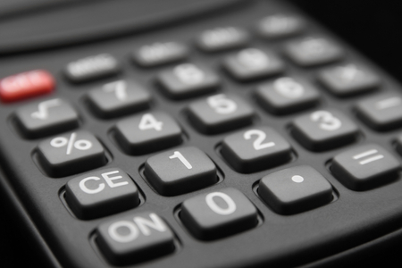 close up of calculator keypad in black backgroundの写真素材