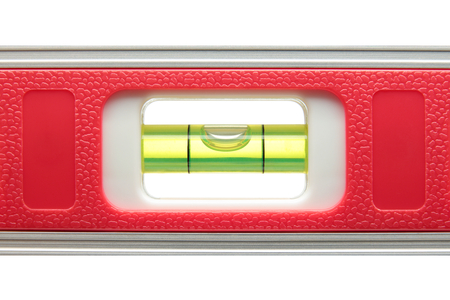 close up of red water level tool isolated on white background