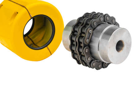 Chain gear is driven by an electric motor for industrial use on white backgroundの写真素材