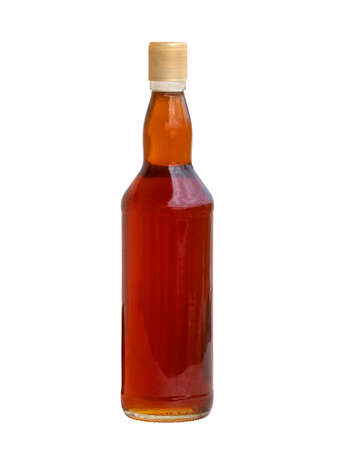 Wild honey is packaged in preserved clear glass jars. on a white backgroundの写真素材