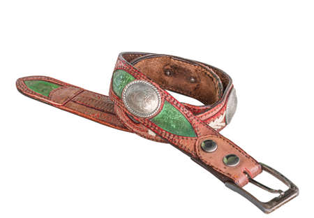 Old leather belt, country cowboy style, handcrafted leather artwork on white background.の写真素材