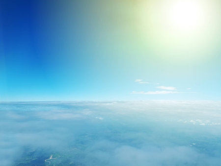 Blue sky with clouds and sunlightの写真素材