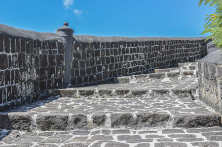 stairs of stones going up to a fortの写真素材