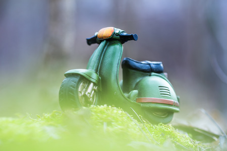 Green Retro Motorcycle toy in natureの写真素材